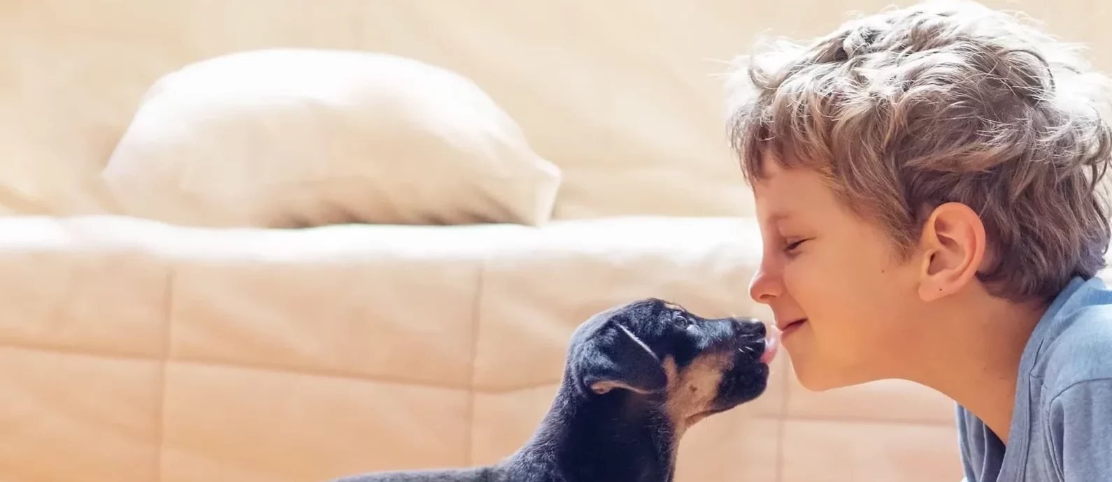 A boy bonding with his puppy