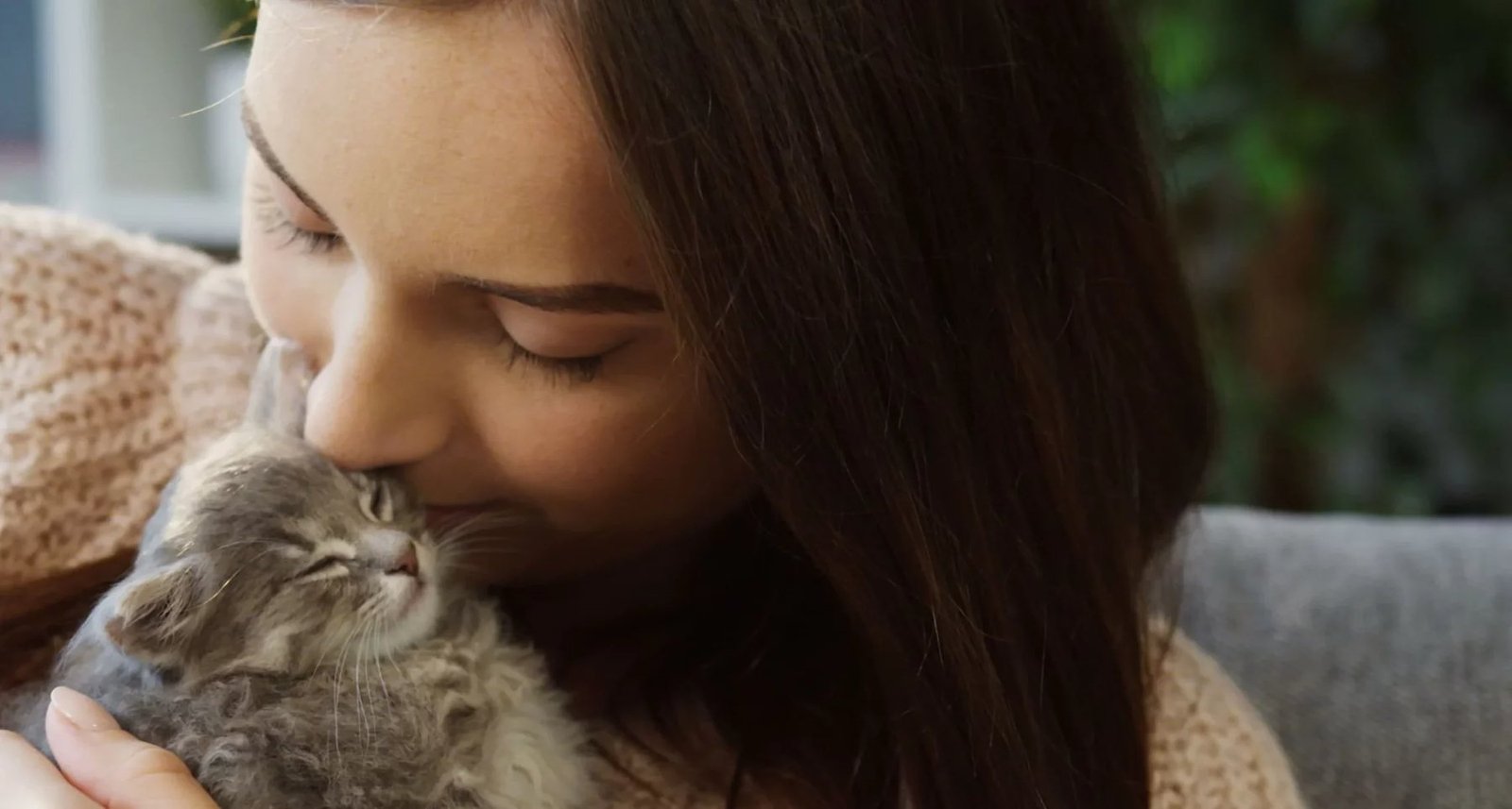 A girl bonding with her kitten